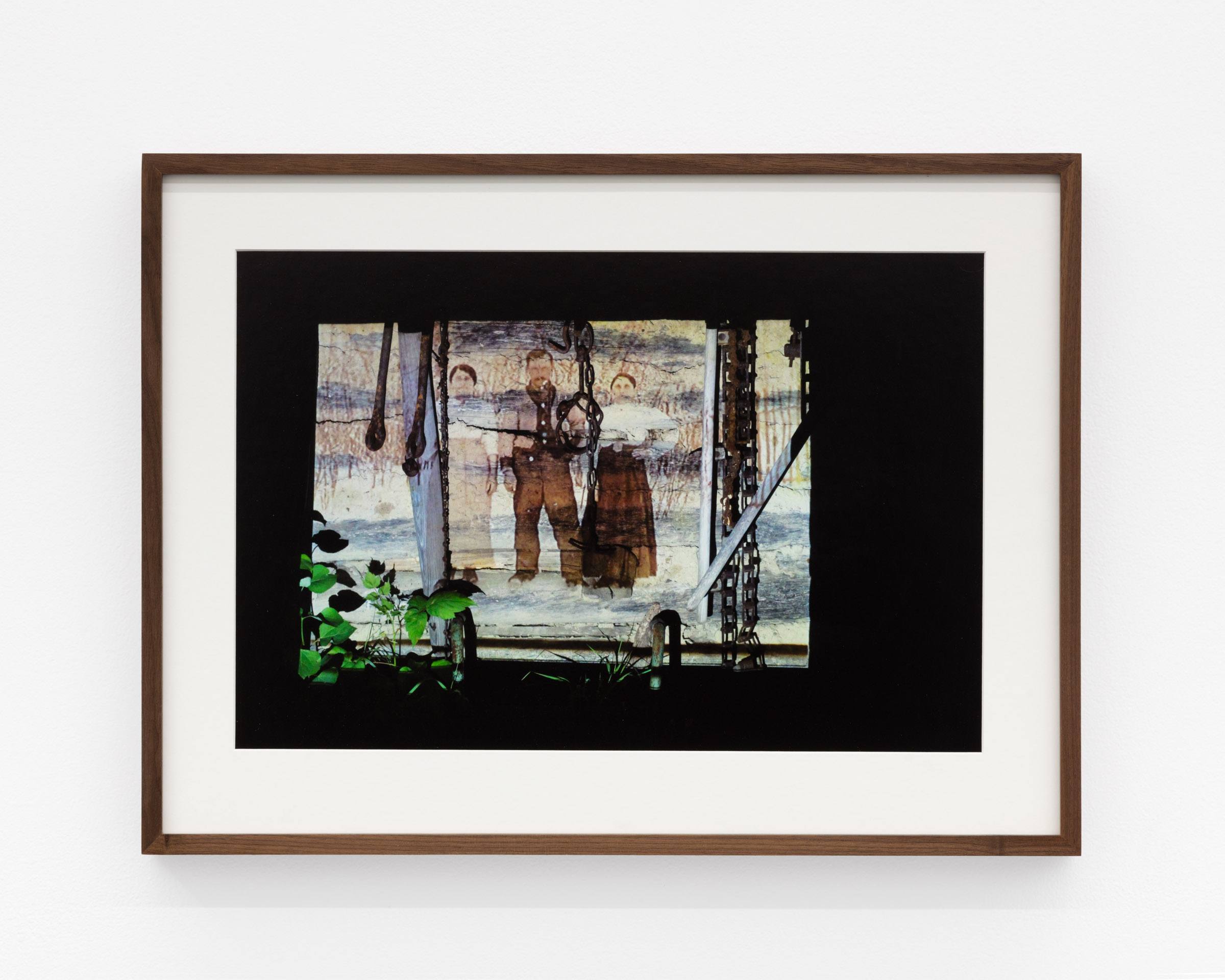 A Carpathian region Ukrainian dance costume is compressed beneath a sheet of glass.