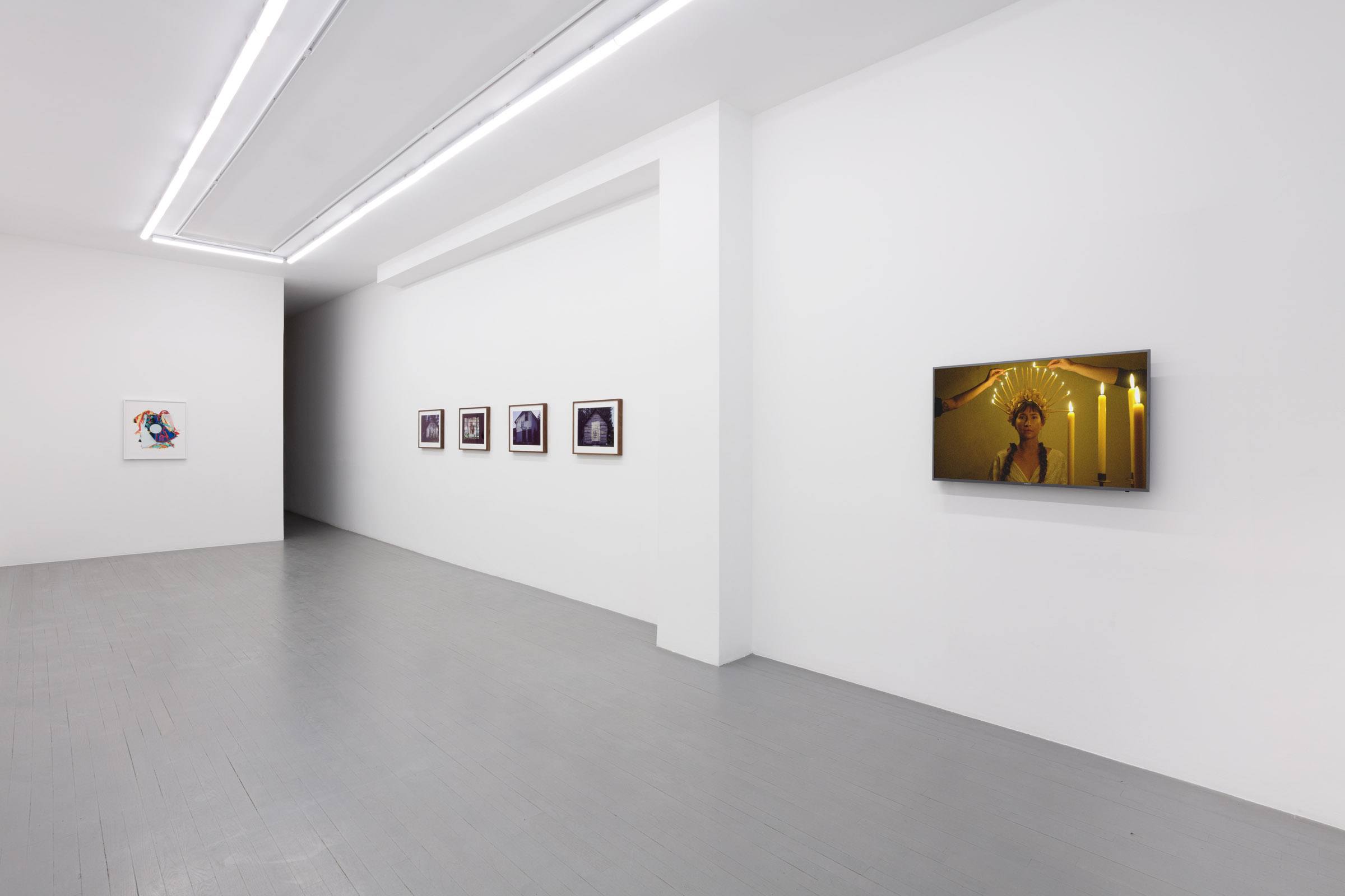 A Carpathian region Ukrainian dance costume is compressed beneath a sheet of glass.